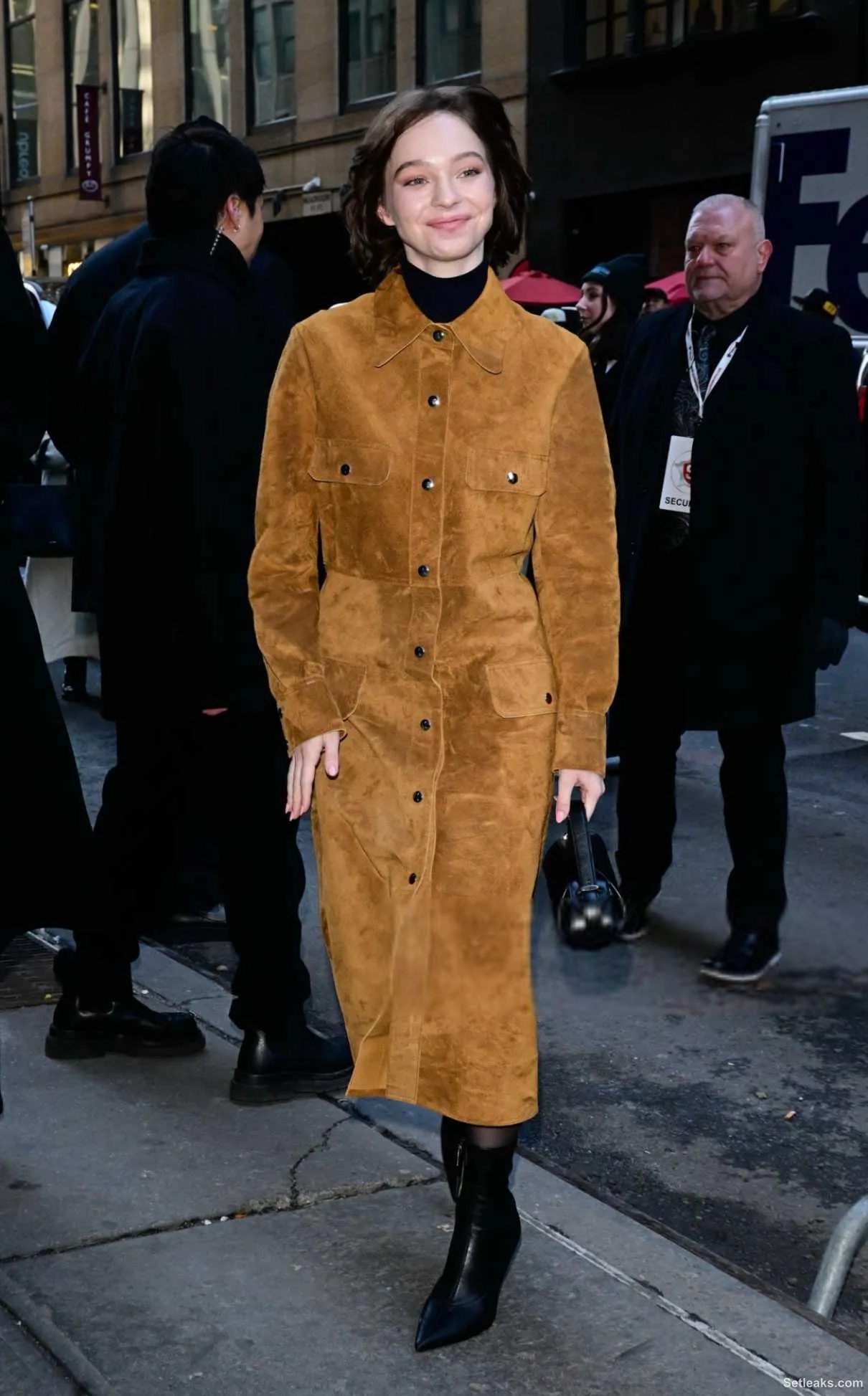 Emma Myers in an Orange Coat Arrives at the Calvin Klein Fashion Show ...